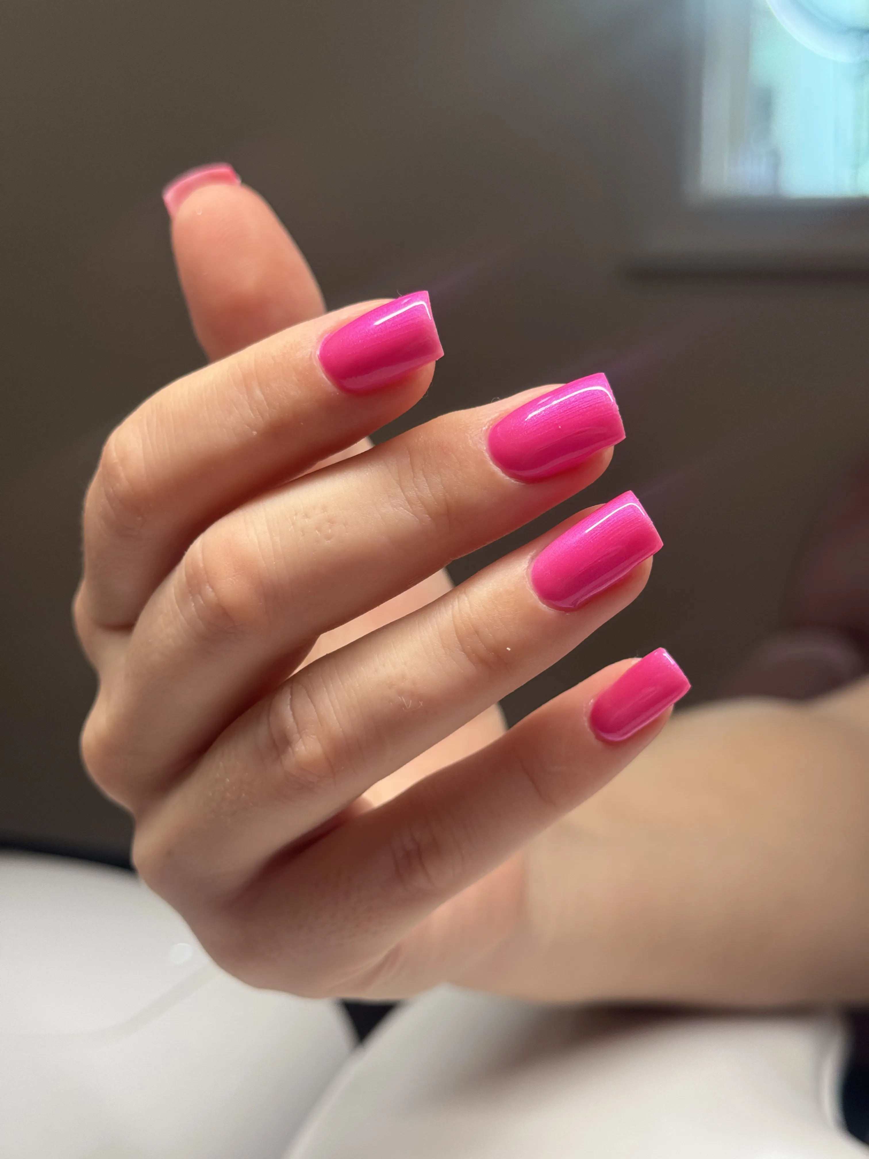 Square nails in glossy magenta-pink gel polish