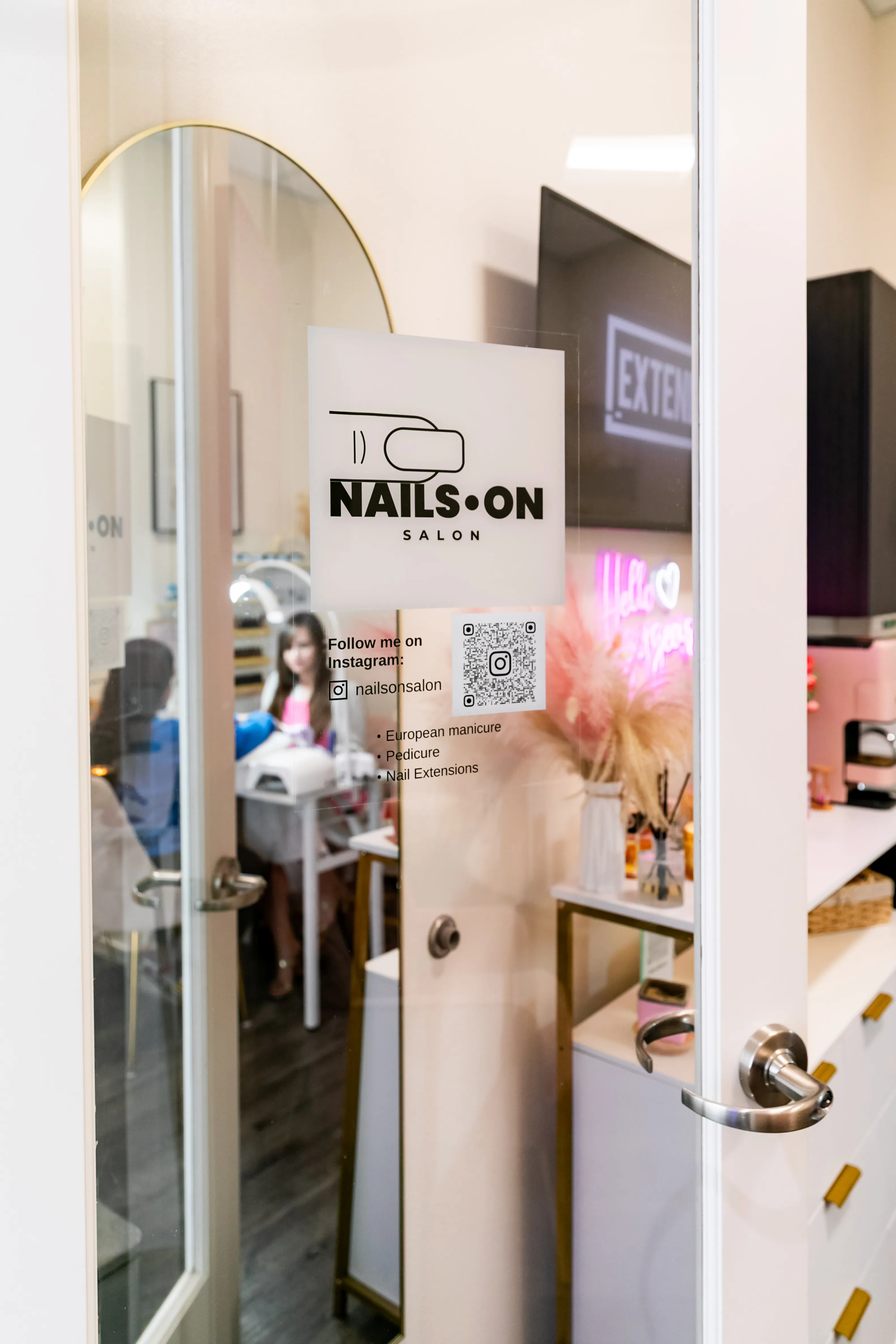 Nails On Salon studio door with logo